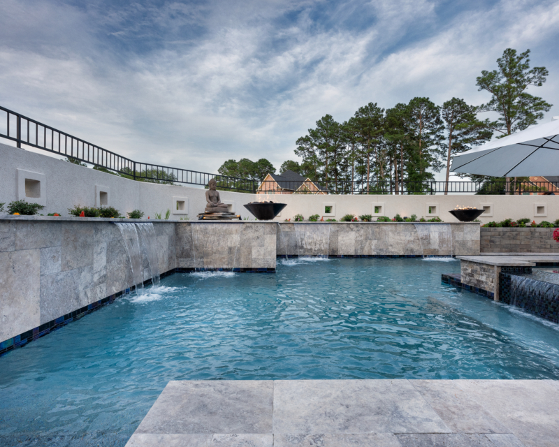 pool side view of pool fountains